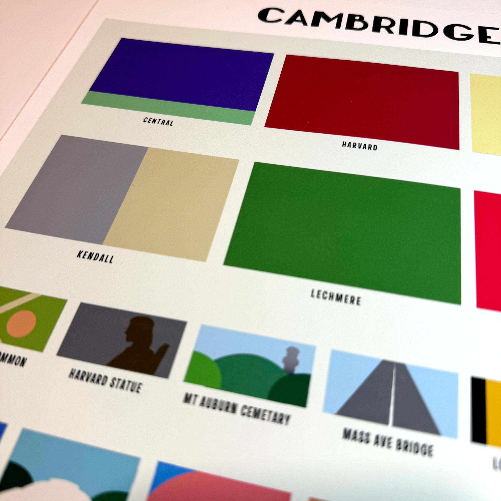 close up of design of cambridge ma with blocks of color respresenting each neighborhood and attraction