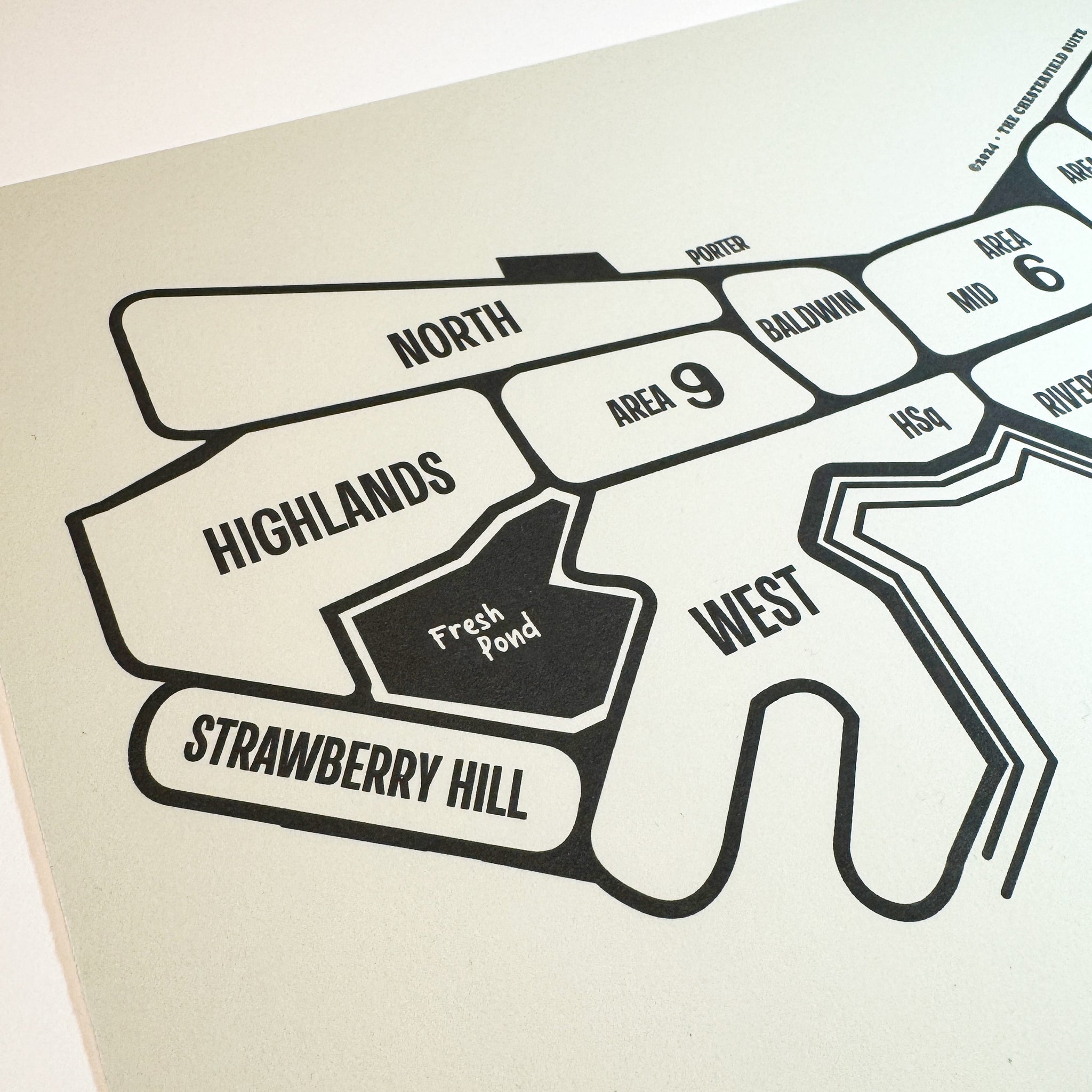 close up of hand drawn design of the cambridge massachusetts map with dark grey lines and artwork