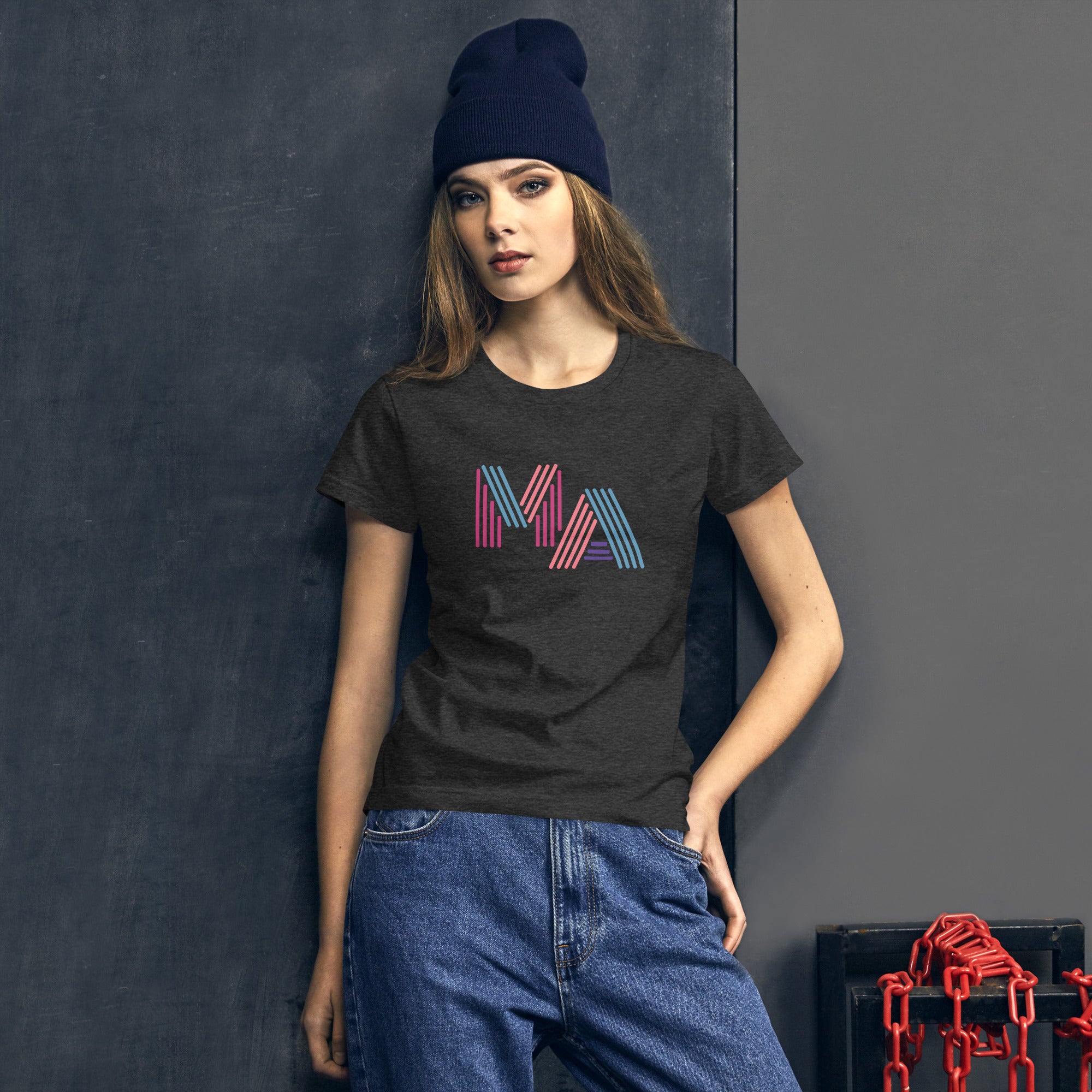 photo of woman wearing dark grey t-shirt with the letters MA in pink, orange, turquoise and purple neon light style lettering
