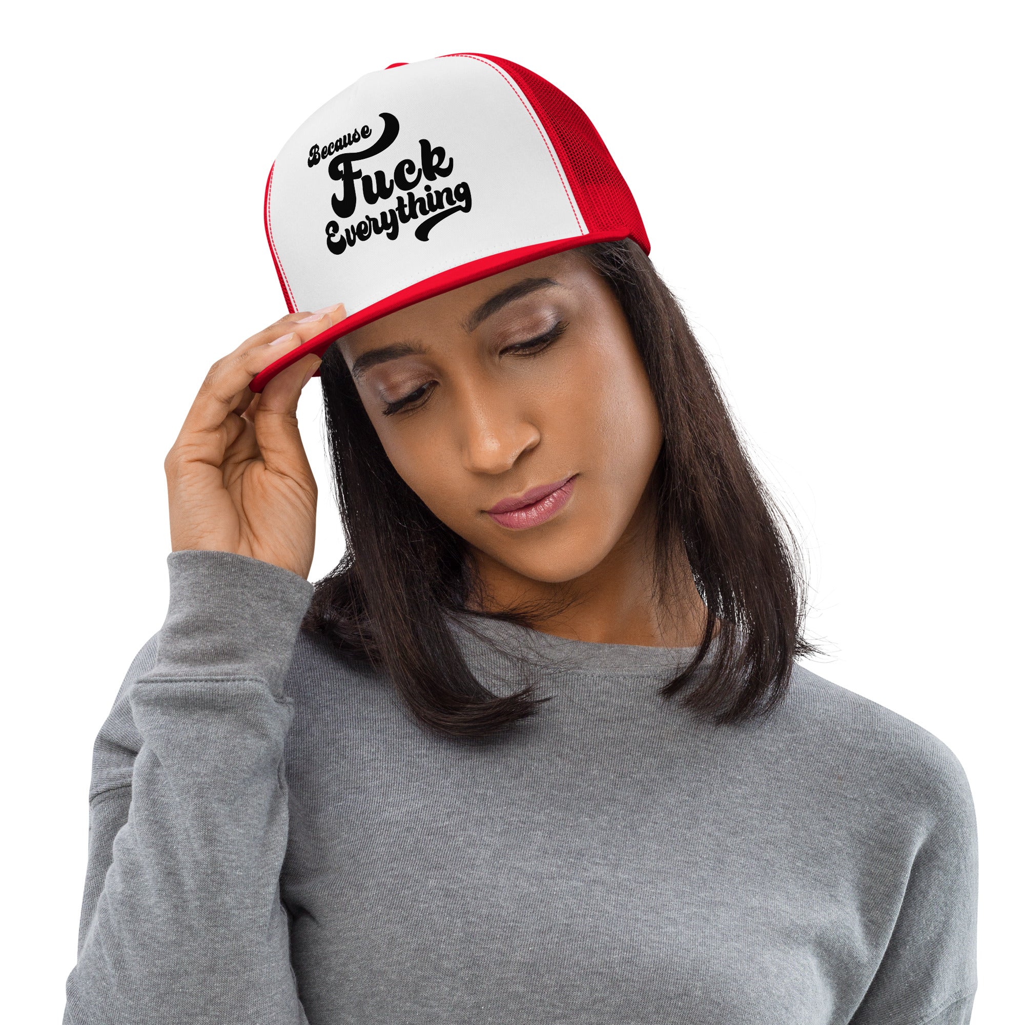 woman wearing red mesh, white front trucker cap with the words Because Fuck Everything written on the front