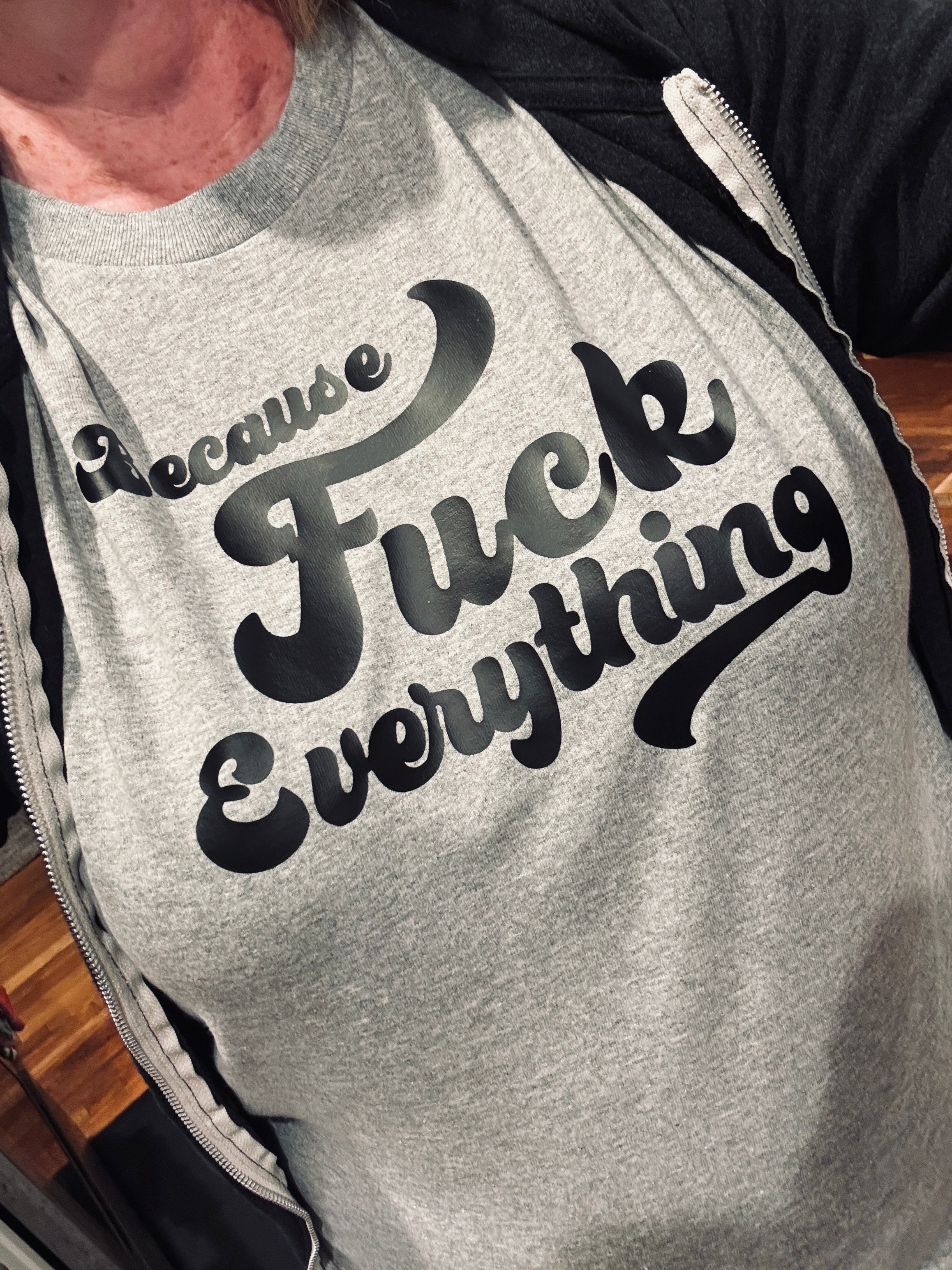Woman wearing B.F.E. Because Fuck Everything t-shirt in grey