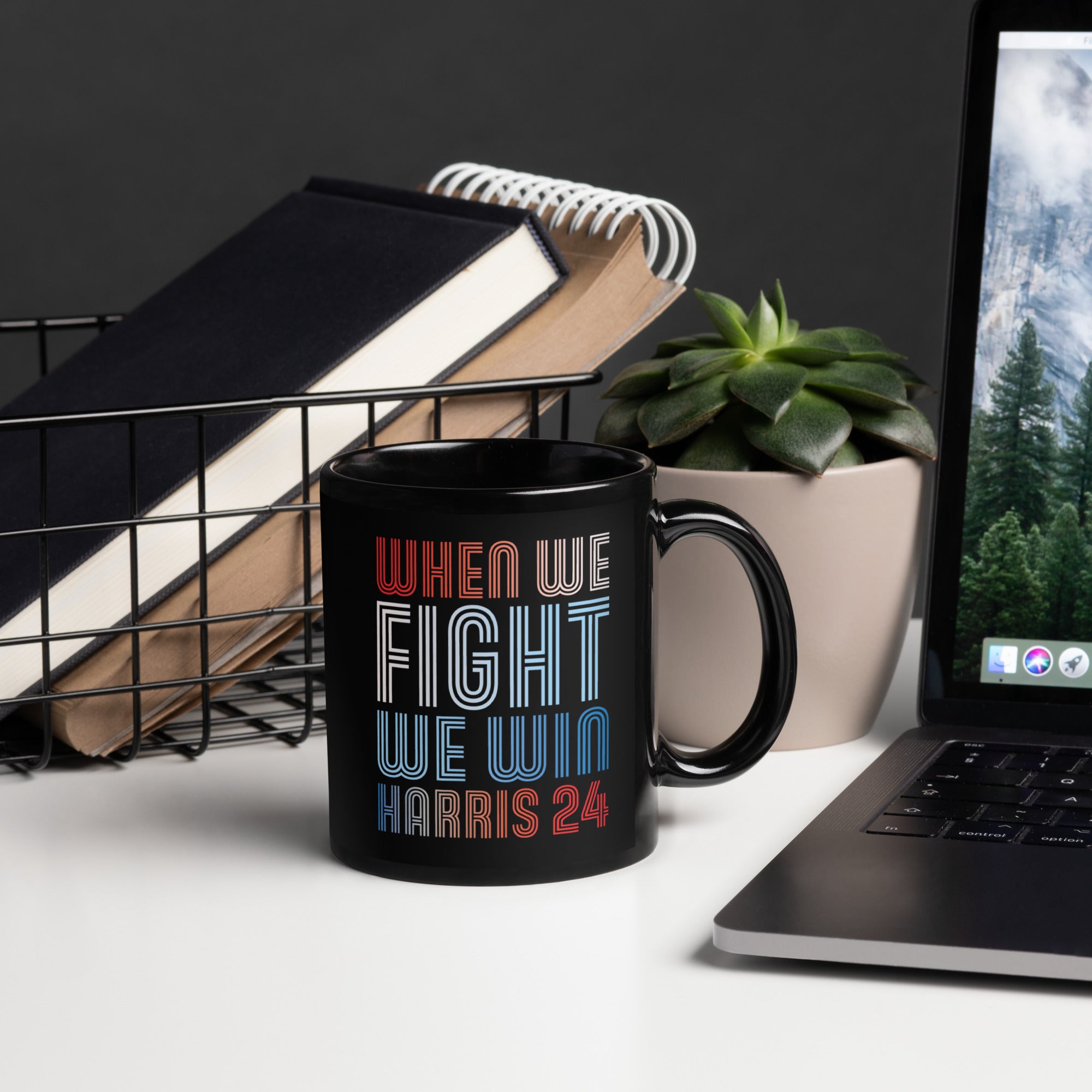 black ceramic mug with when we fight we win harris 24 in red white and blue blended text