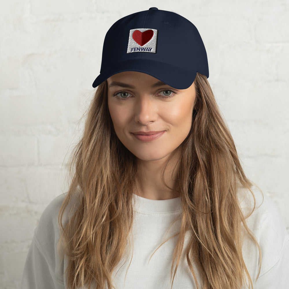 photo of woman wearing graphic of the citgo sign boston fenway as a heart embroidered on baseball hat