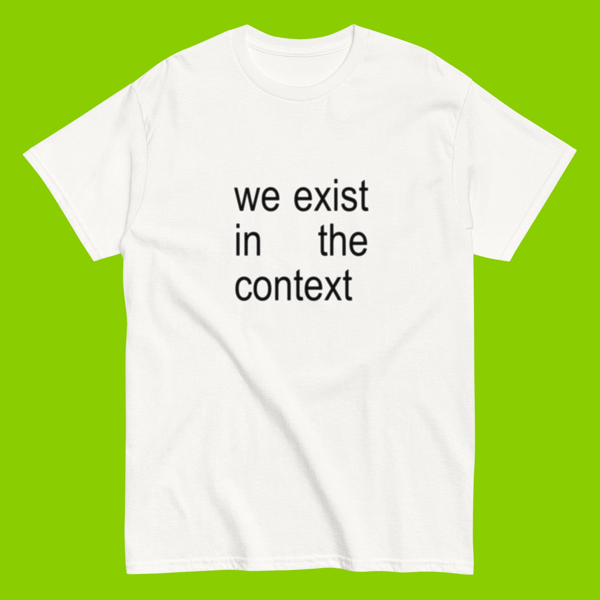 white unisex t-shirt with the phrase we exist in the context from kamala harris and charli xcx brat