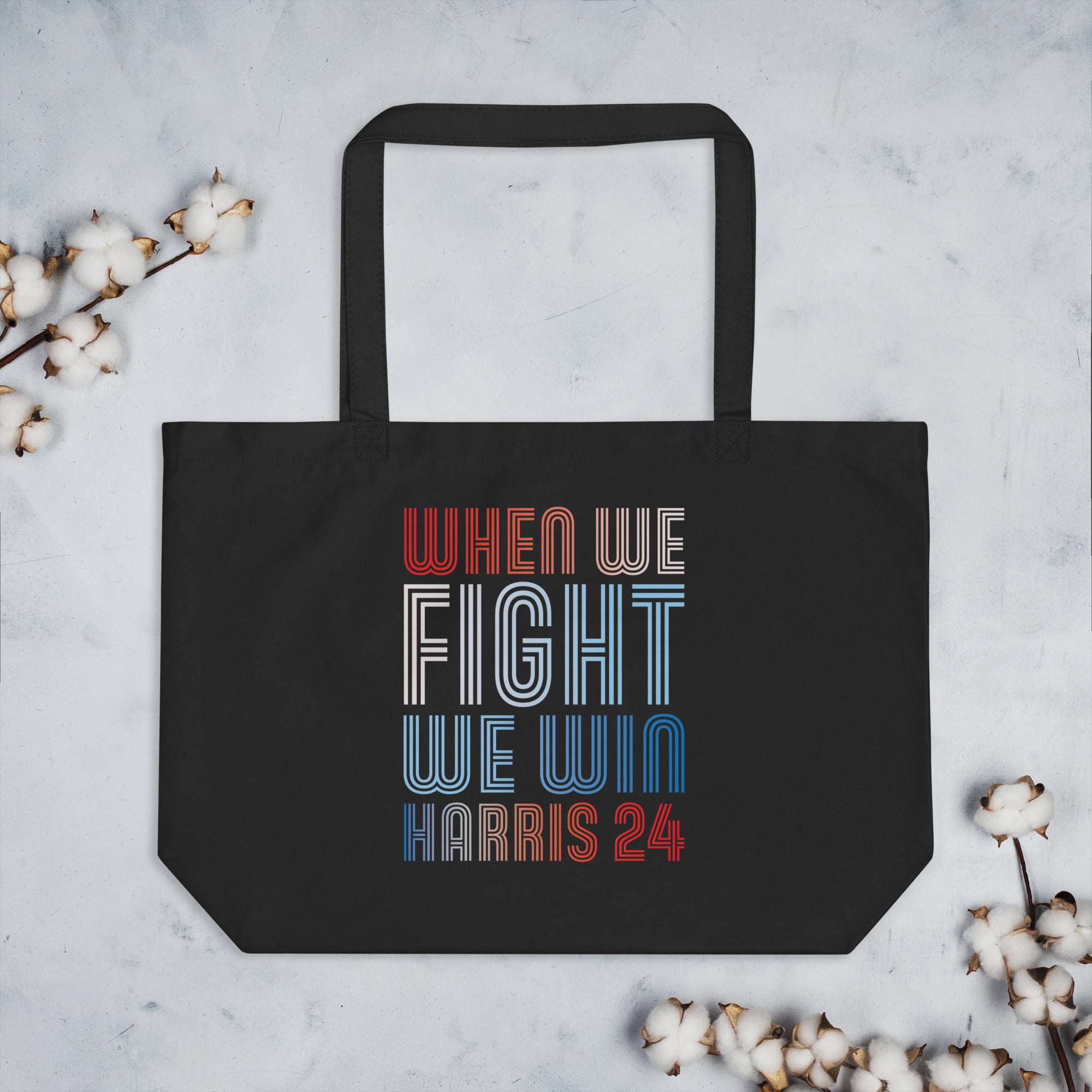 black large tote bag with when we fight we win harris 24 in red white and blue blended text