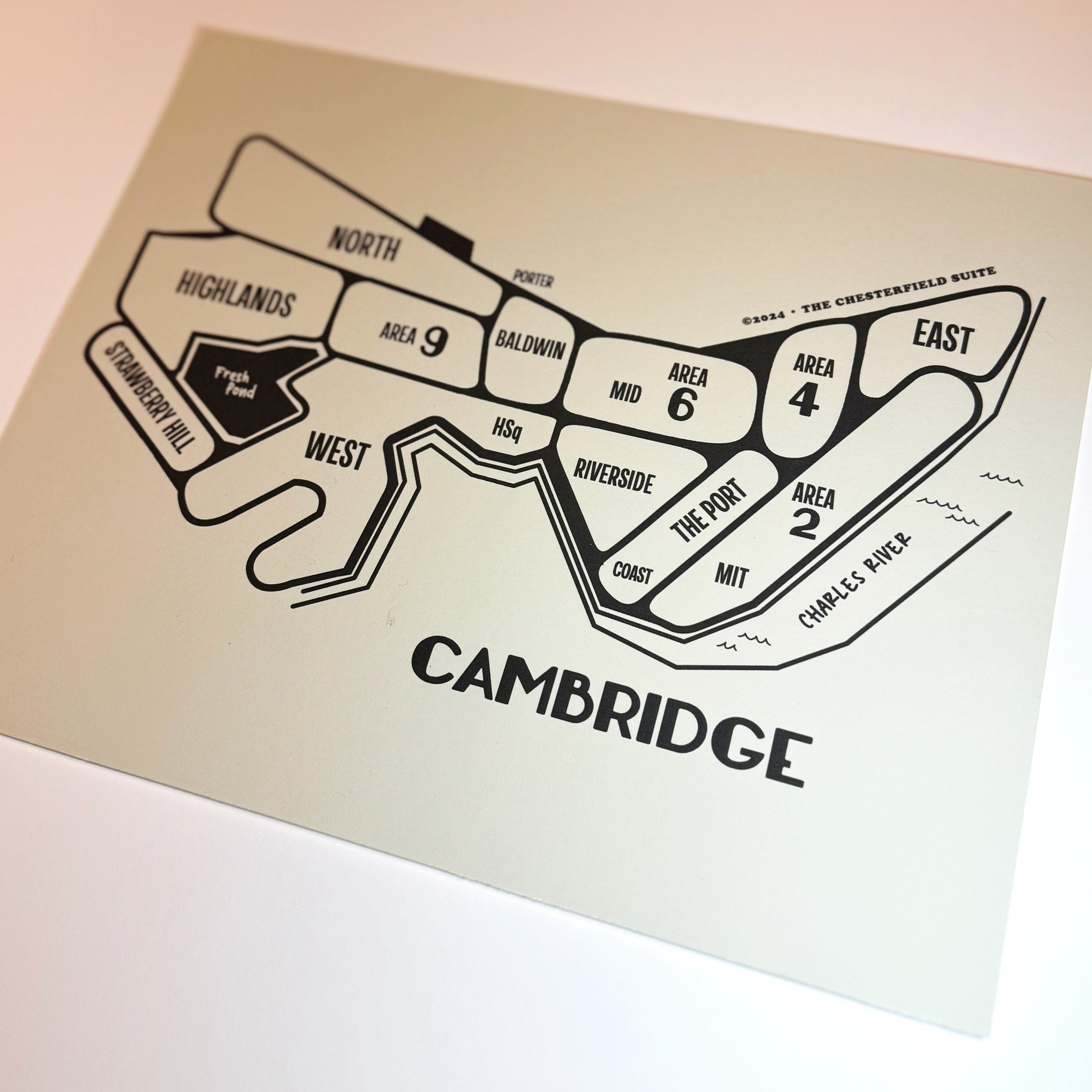 close up of hand drawn design of the cambridge massachusetts map with dark grey lines and artwork