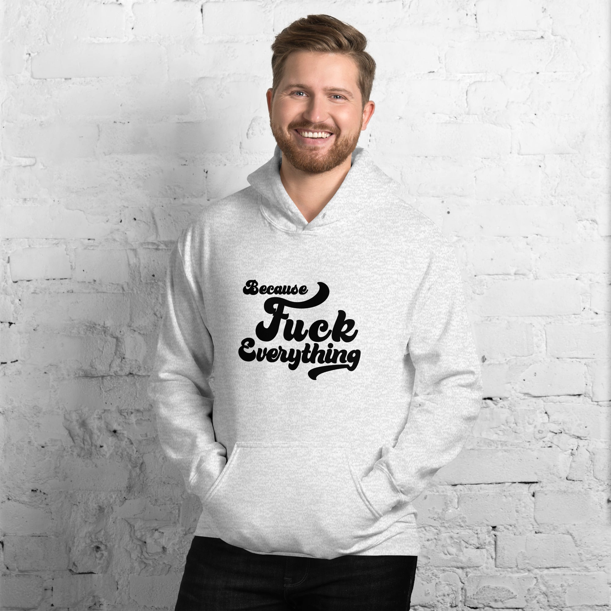 man wearing ash grey Unisex hoodie with the words Because Fuck Everything in bold black cursive text Fuck Trump Protest shirt