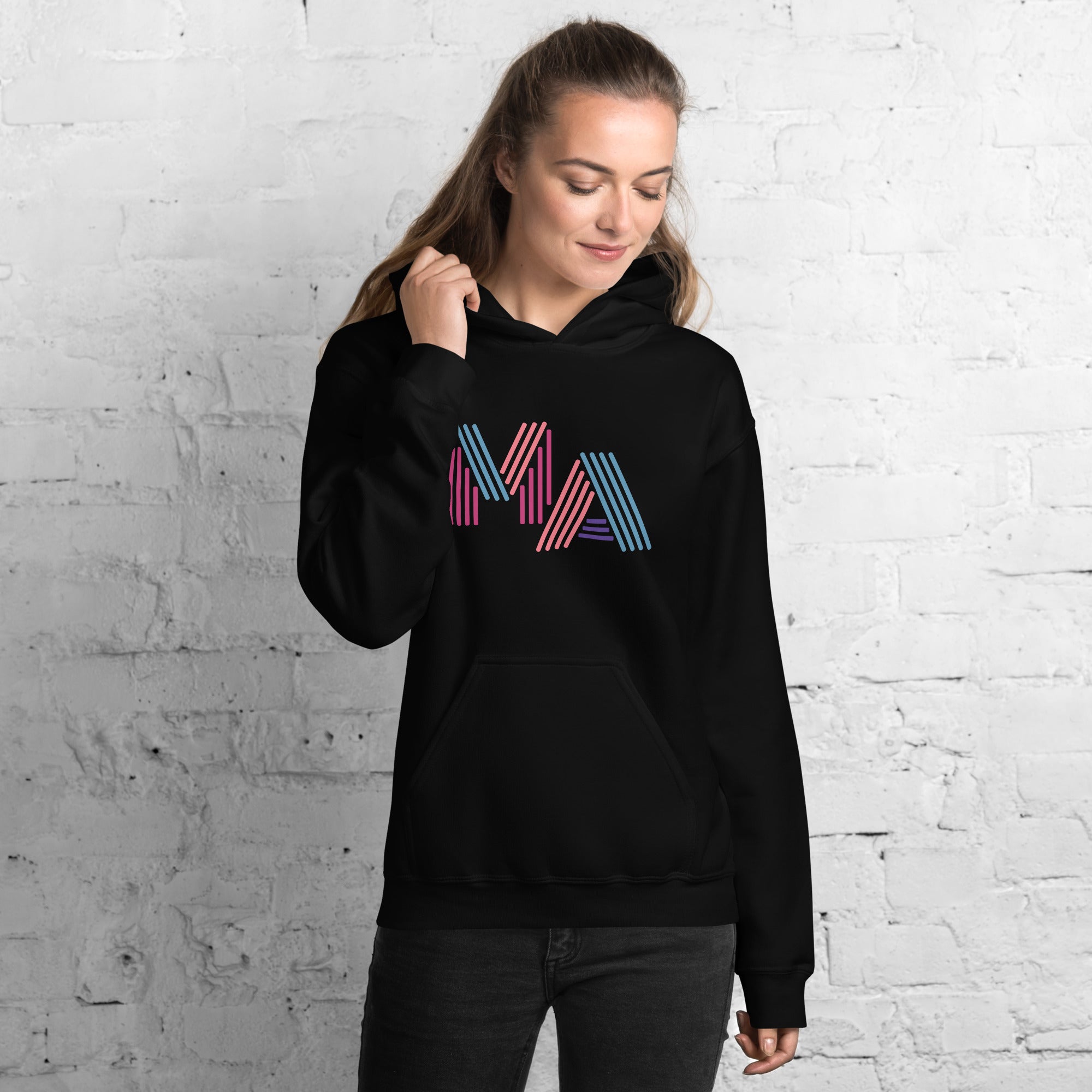 woman wearing unisex black hoodie with the letters MA in pink, orange, turquoise and purple neon light style lettering