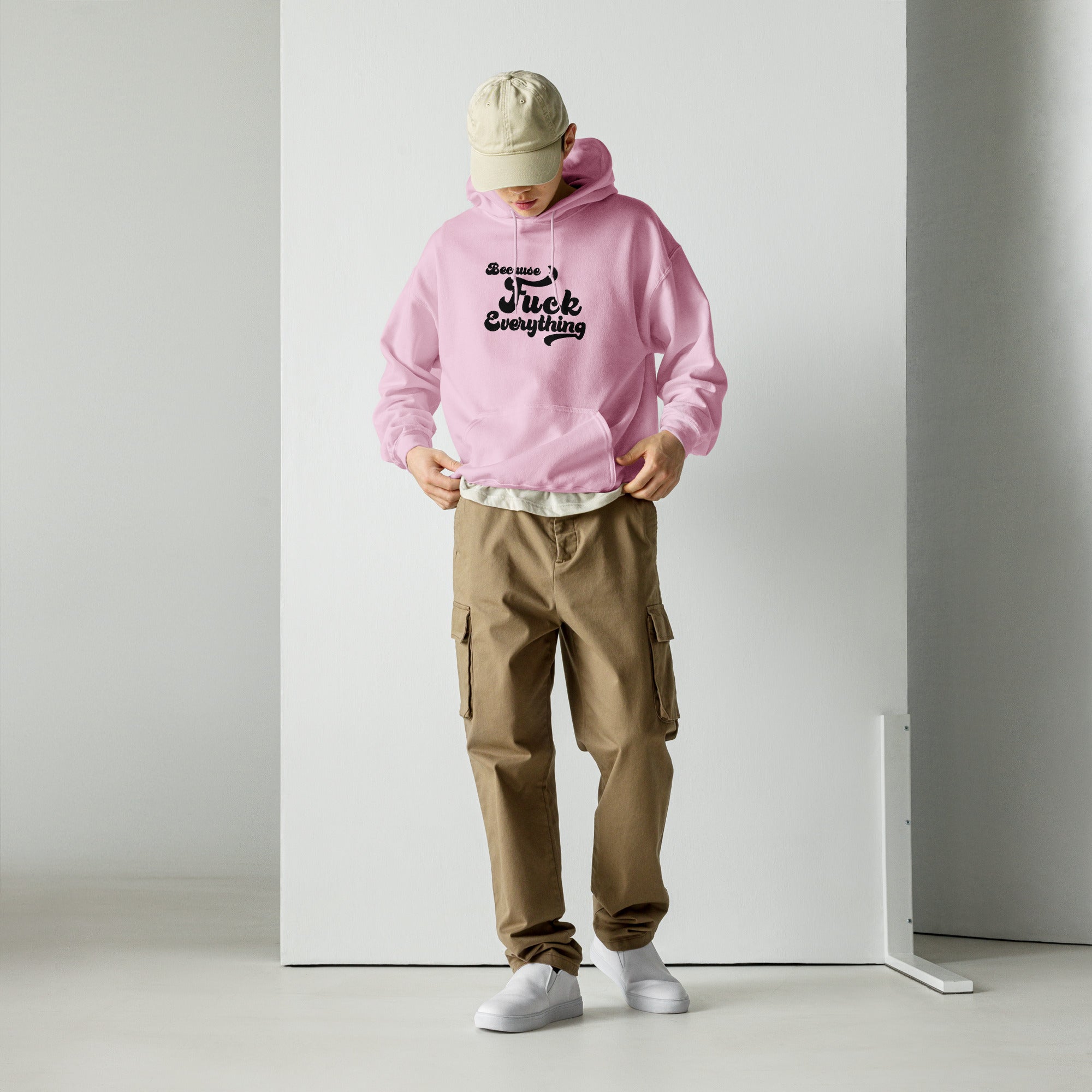 man wearing pink Unisex hoodie with the words Because Fuck Everything in bold black cursive text Fuck Trump Protest shirt