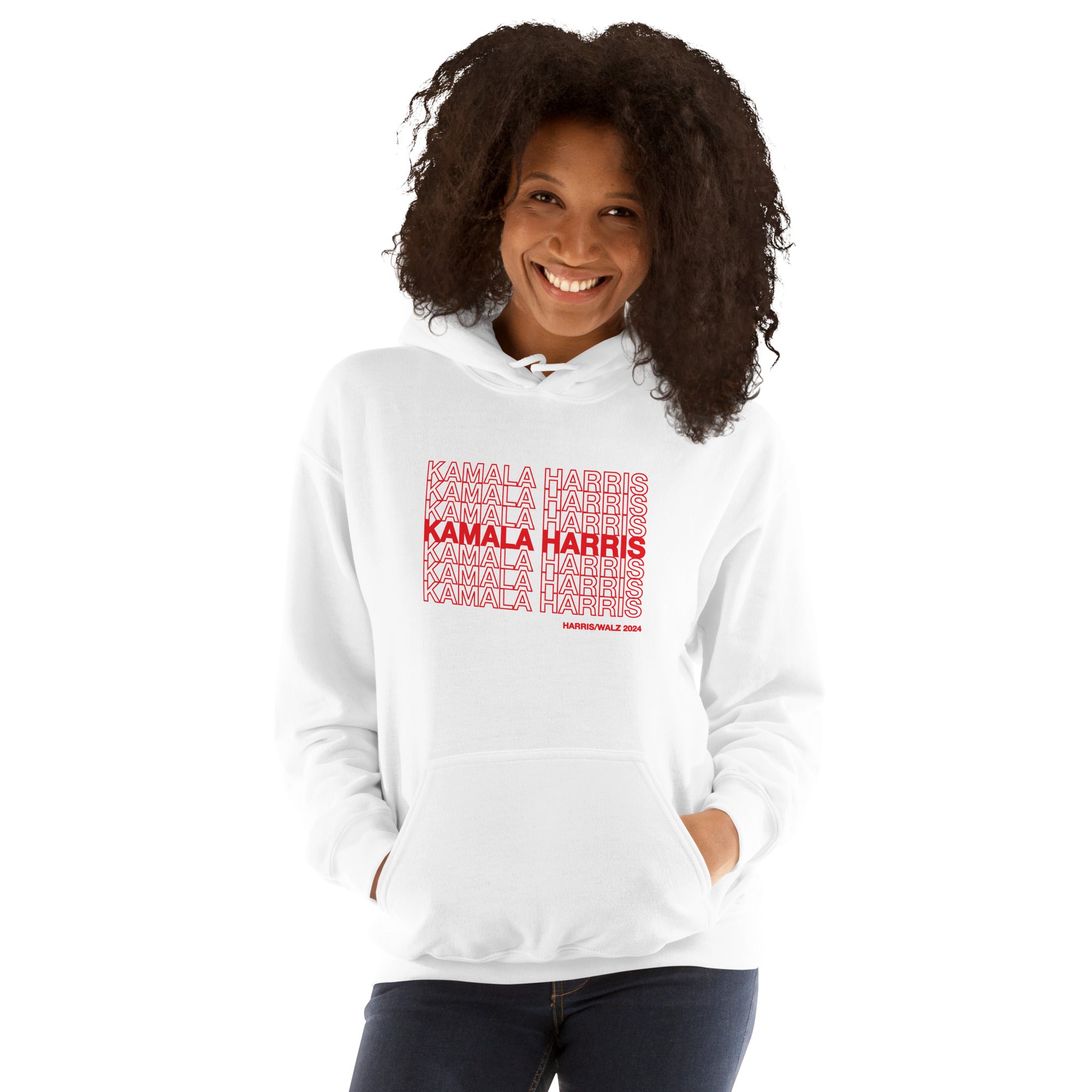 woman wearing White unisex hoodie sweatshirt with red text saying "kamala Harris" in the classic plastic shopping bag design