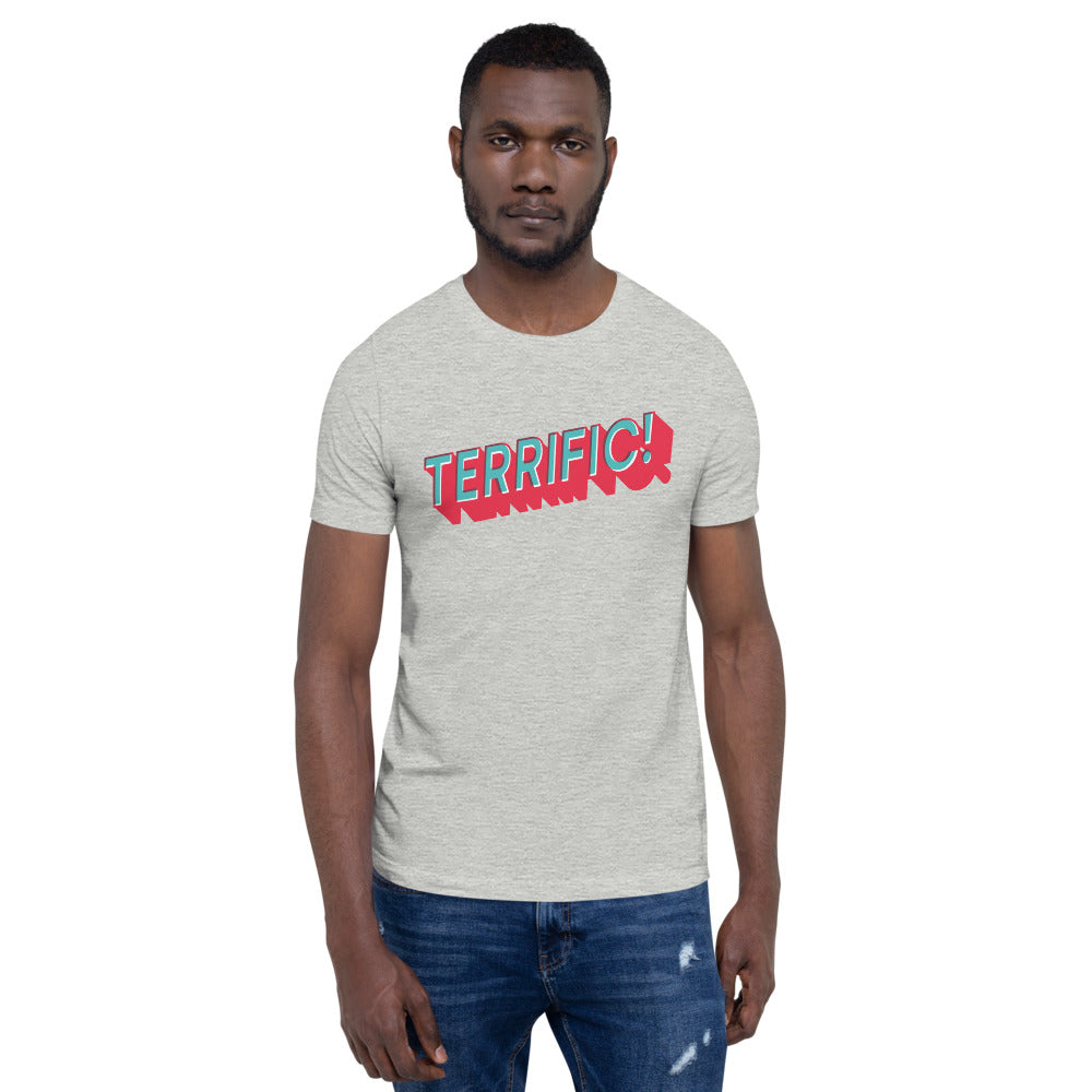 photo of man wearing Terrific! written in turquoise block lettering with red shadow on grey unisex tshirt