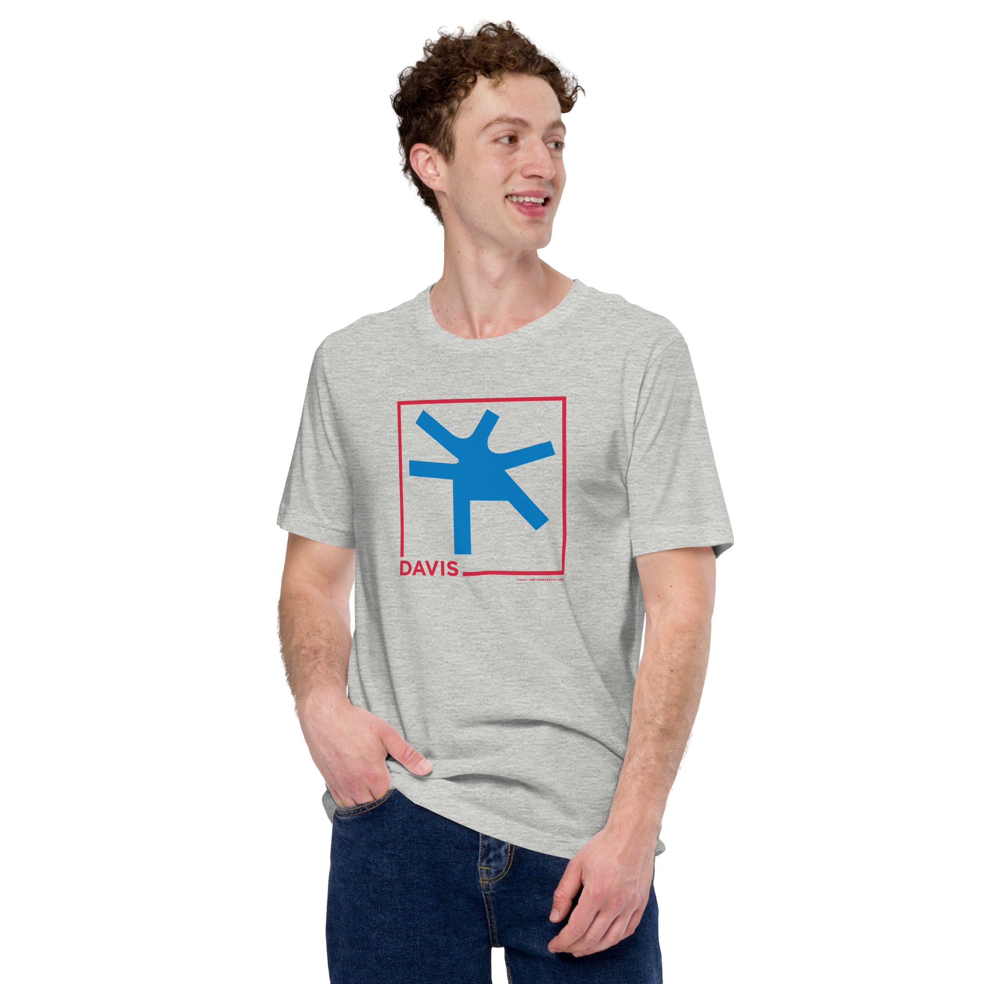 man wearing Grey unisex t-shirt with the word Davis and a square in red, with the blue intersection
