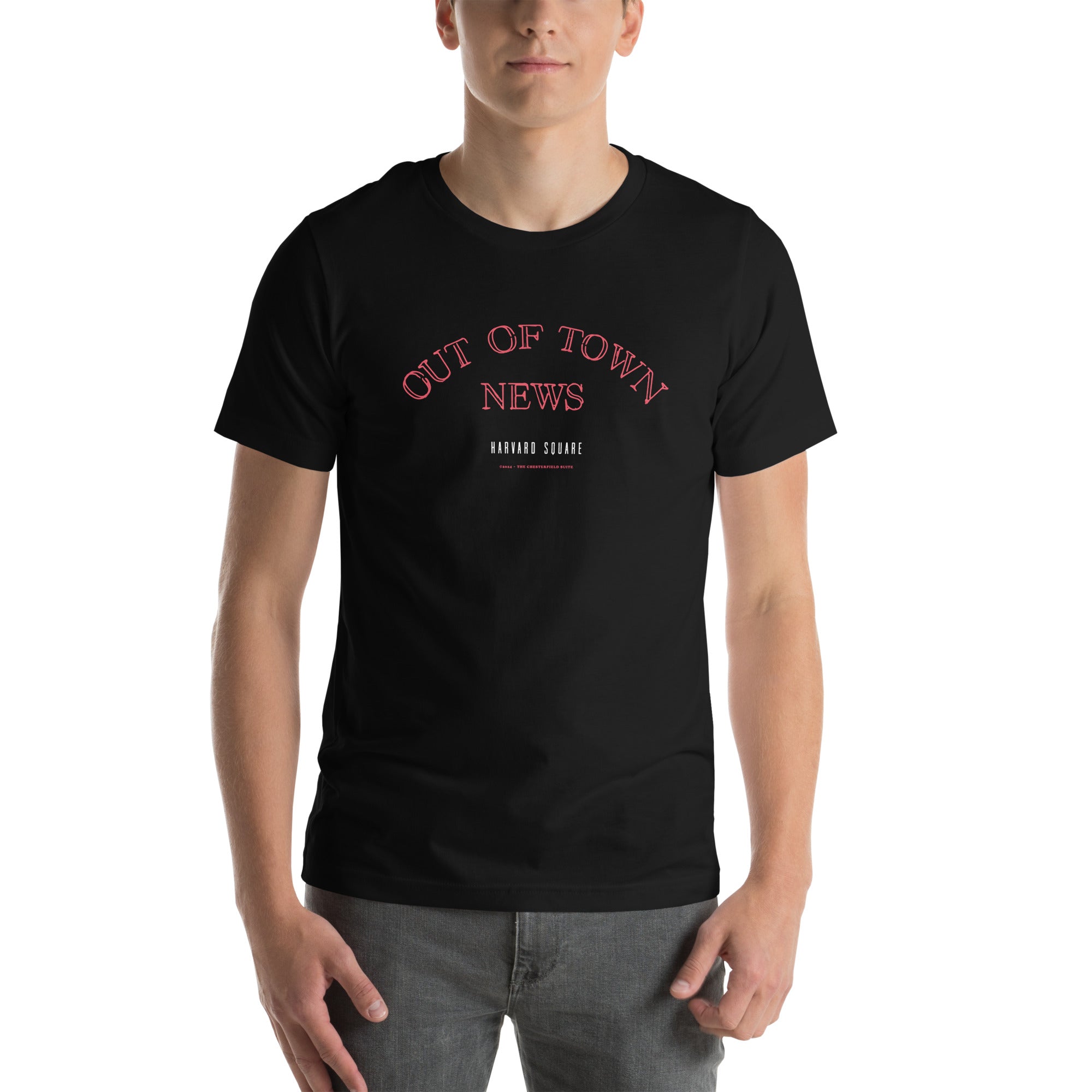 man wearing Black unisex t-shirt with Out of Town News Harvard Square written in red neon