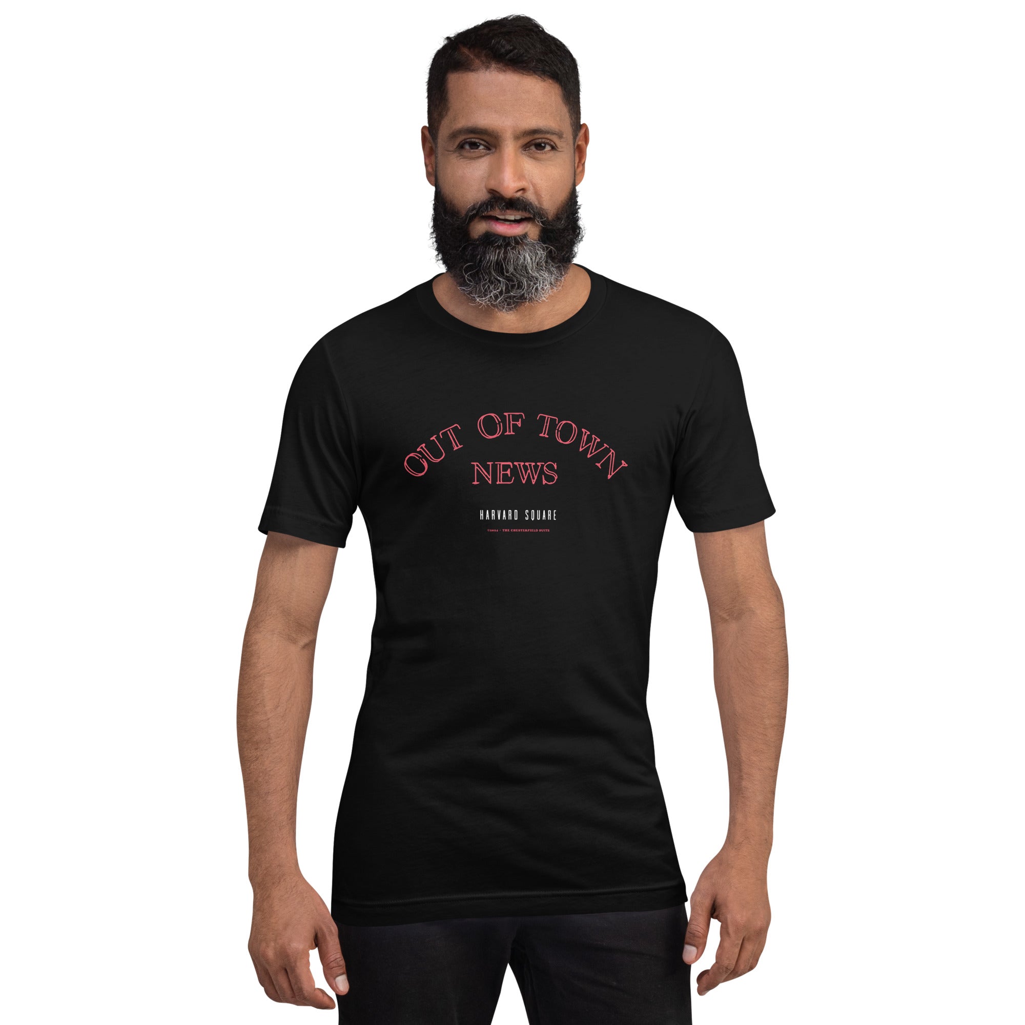 man wearing Black unisex t-shirt with Out of Town News Harvard Square written in red neon