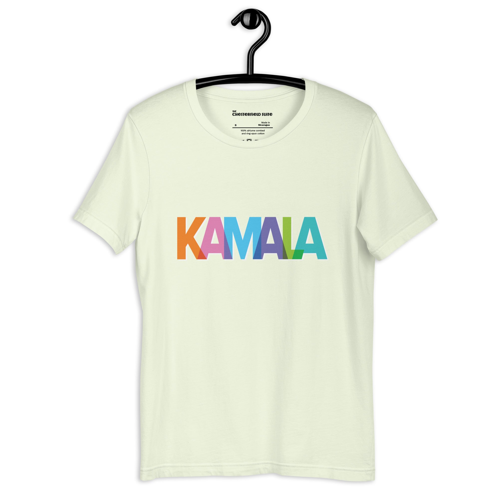 citron colored unisex t-shirt with KAMALA on the front with multi colored overlapping letters on a black hanger