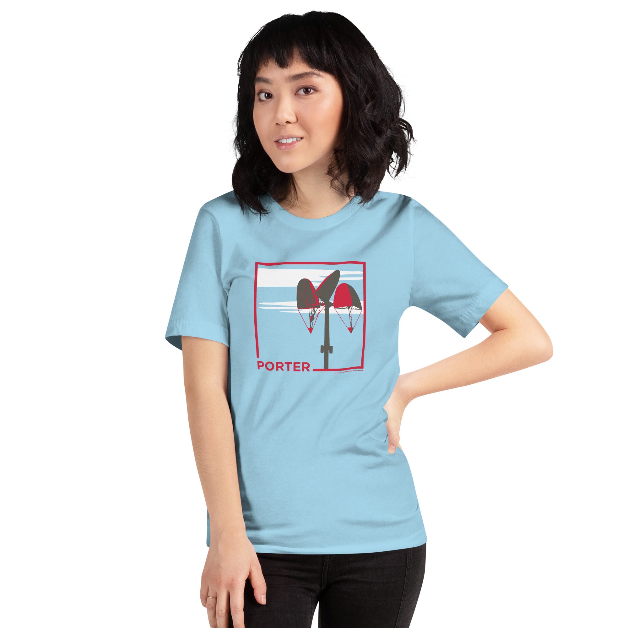 woman wearing light blue unisex t-shirt with the word porter and a square in red, featuring it's mobile and a white cloud