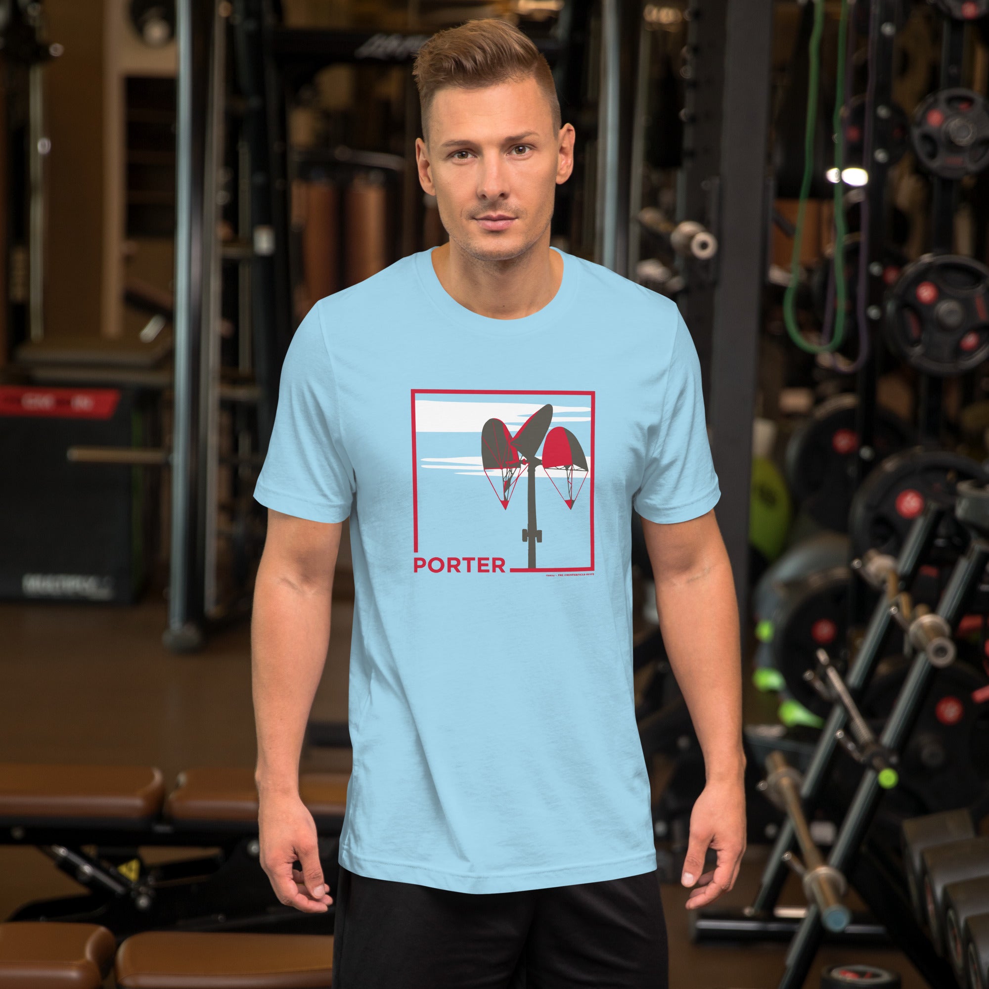 man wearing light blue unisex t-shirt with the word porter and a square in red, featuring it's mobile and a white cloud