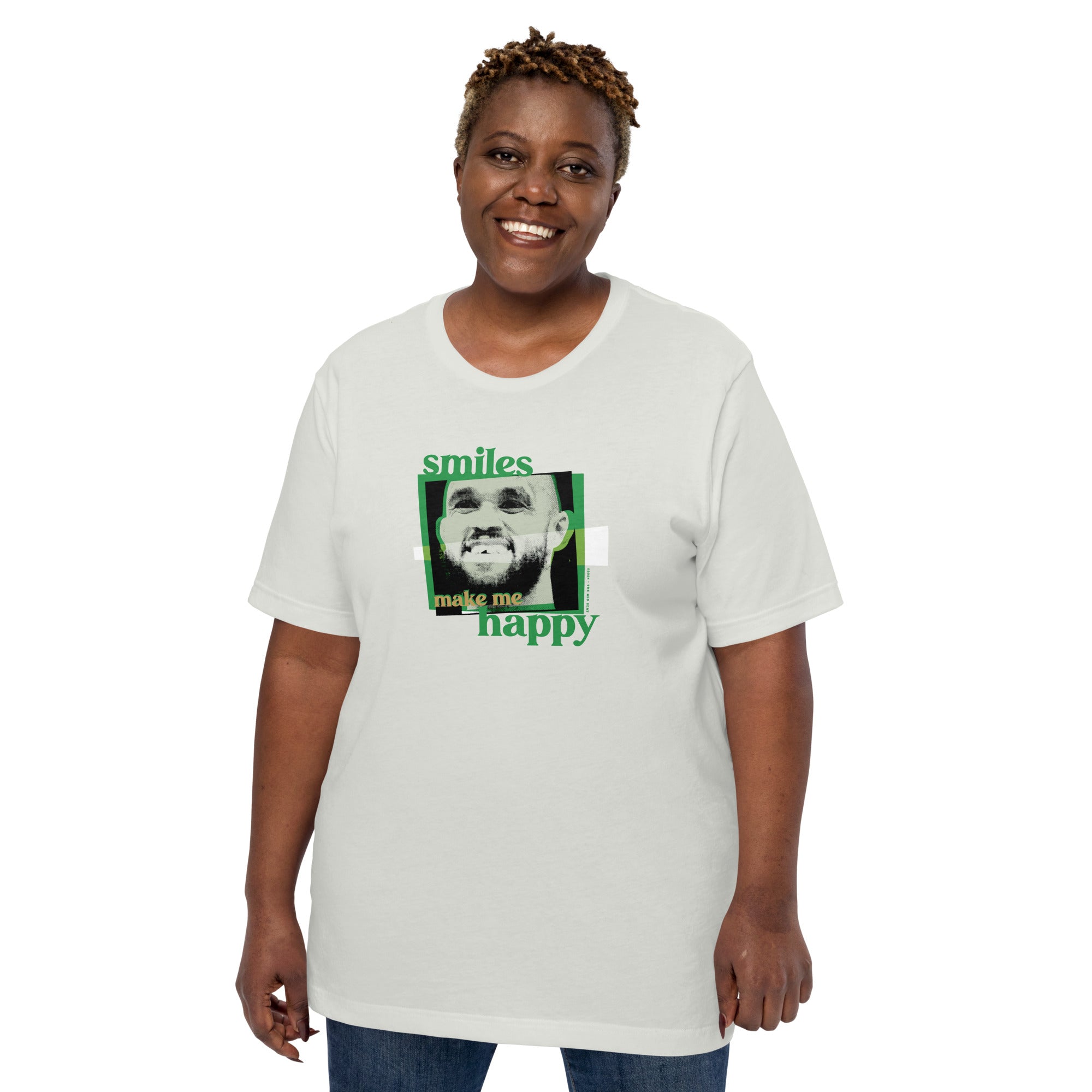 woman wearing silver grey shirt with boston celtics derrick white smiling with a chipped tooth