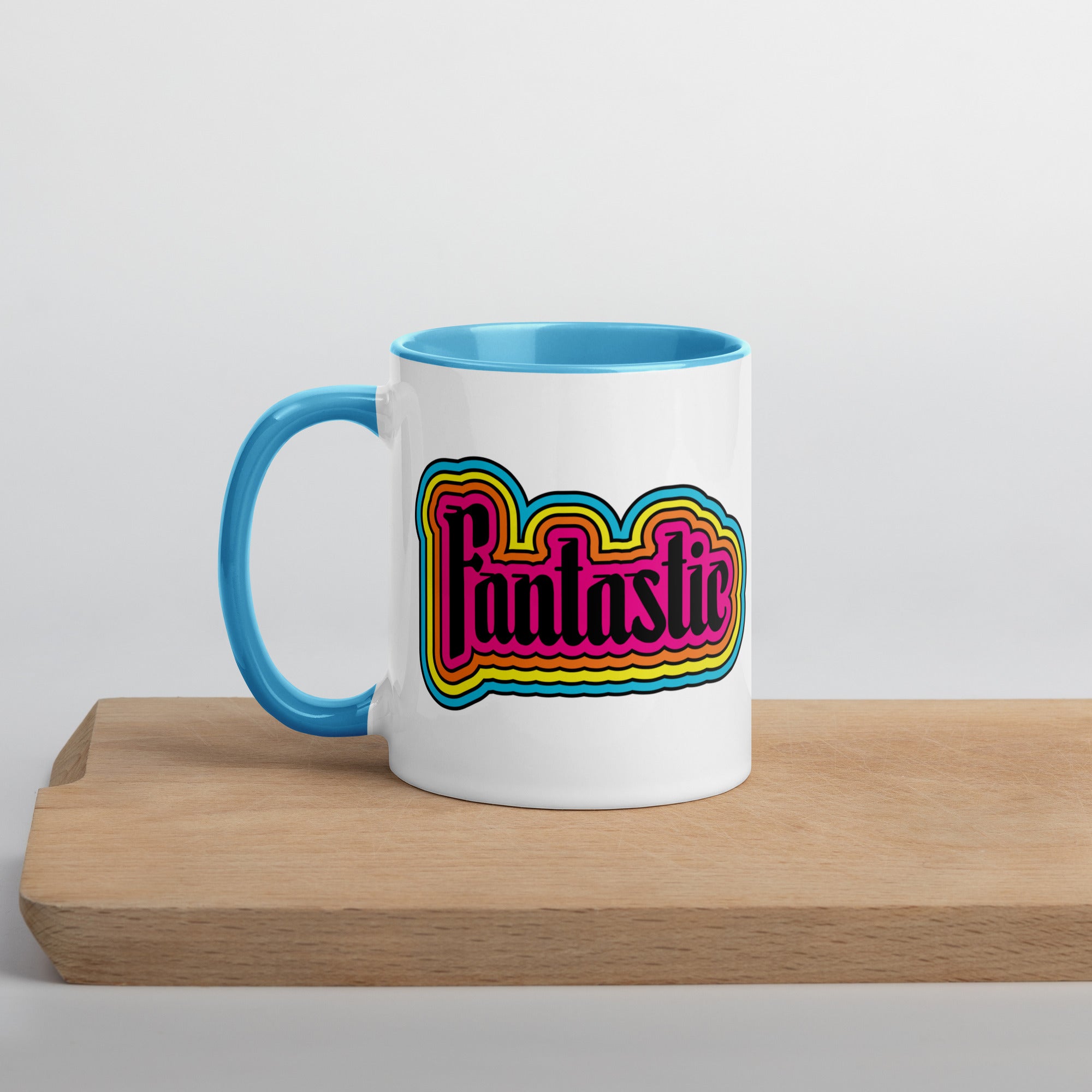 11 oz mug with the word fantastic with rainbow design around it
