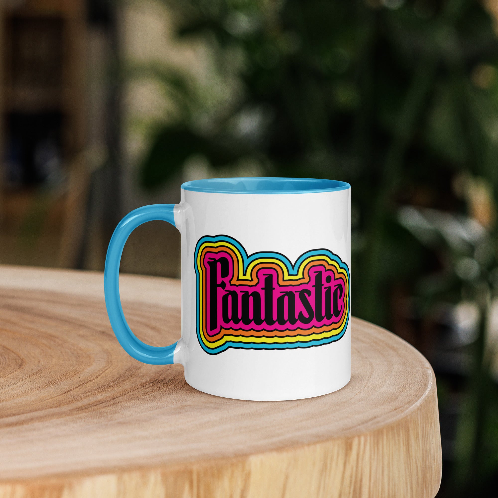 11 oz mug with the word fantastic with rainbow design around it