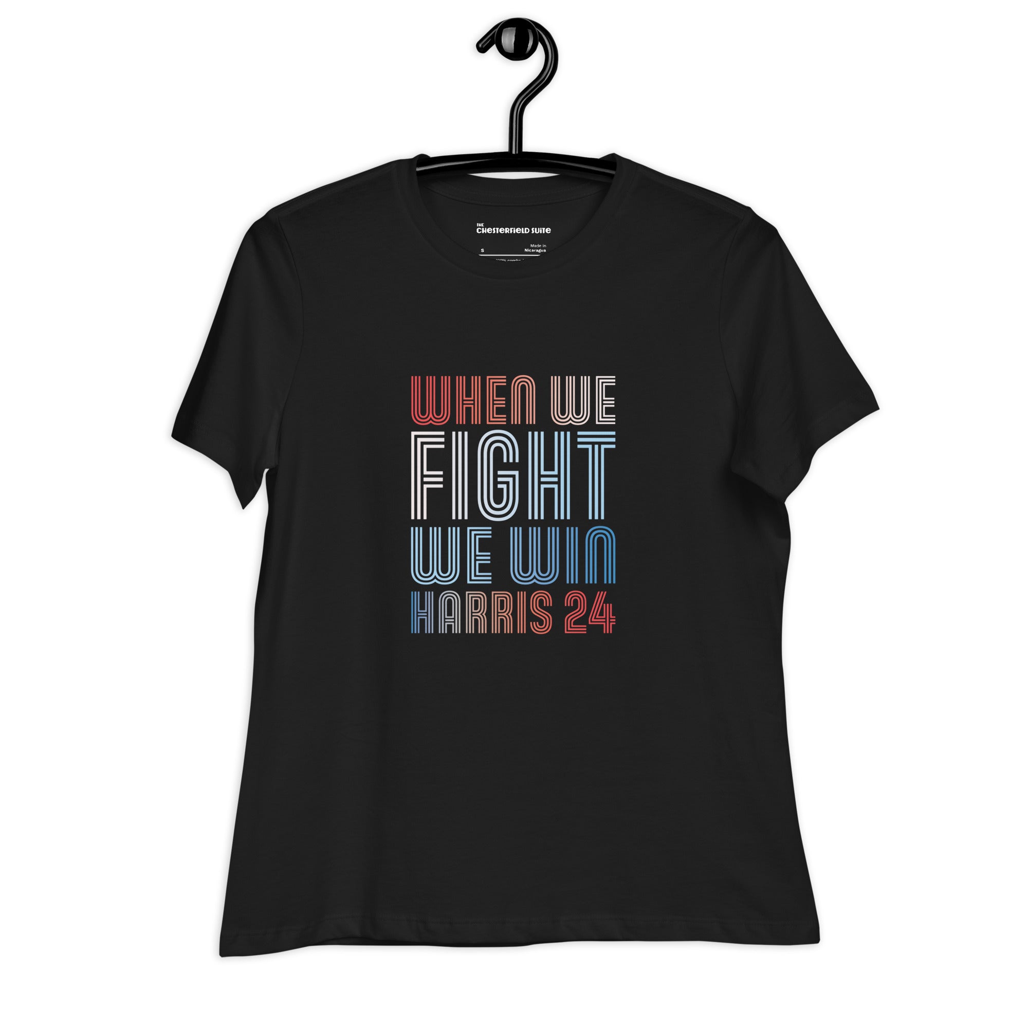 black women's shirt with when we fight we win harris 24 in red white and blue blended text on a hanger