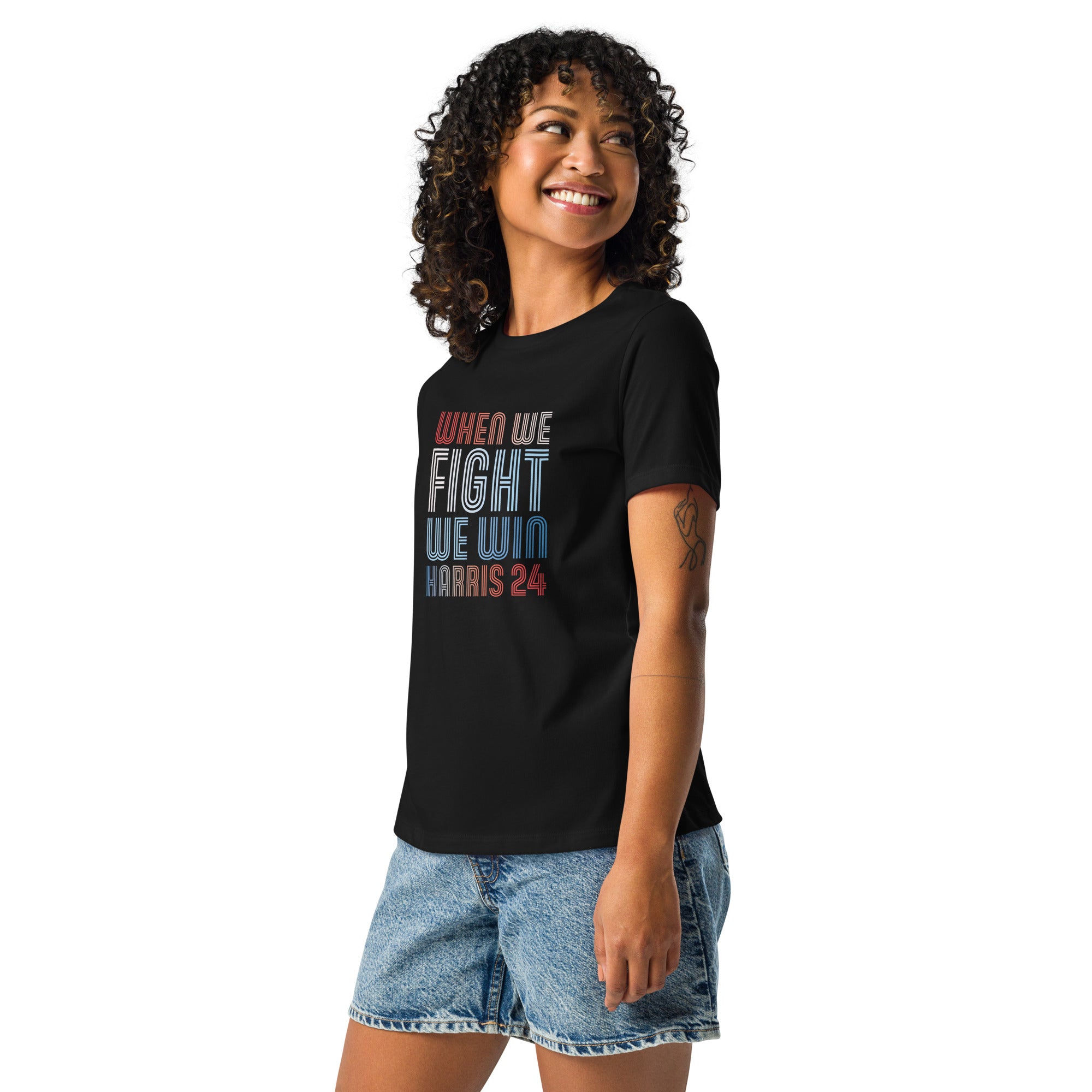 woman wearing black women's shirt with when we fight we win harris 24 in red white and blue blended text