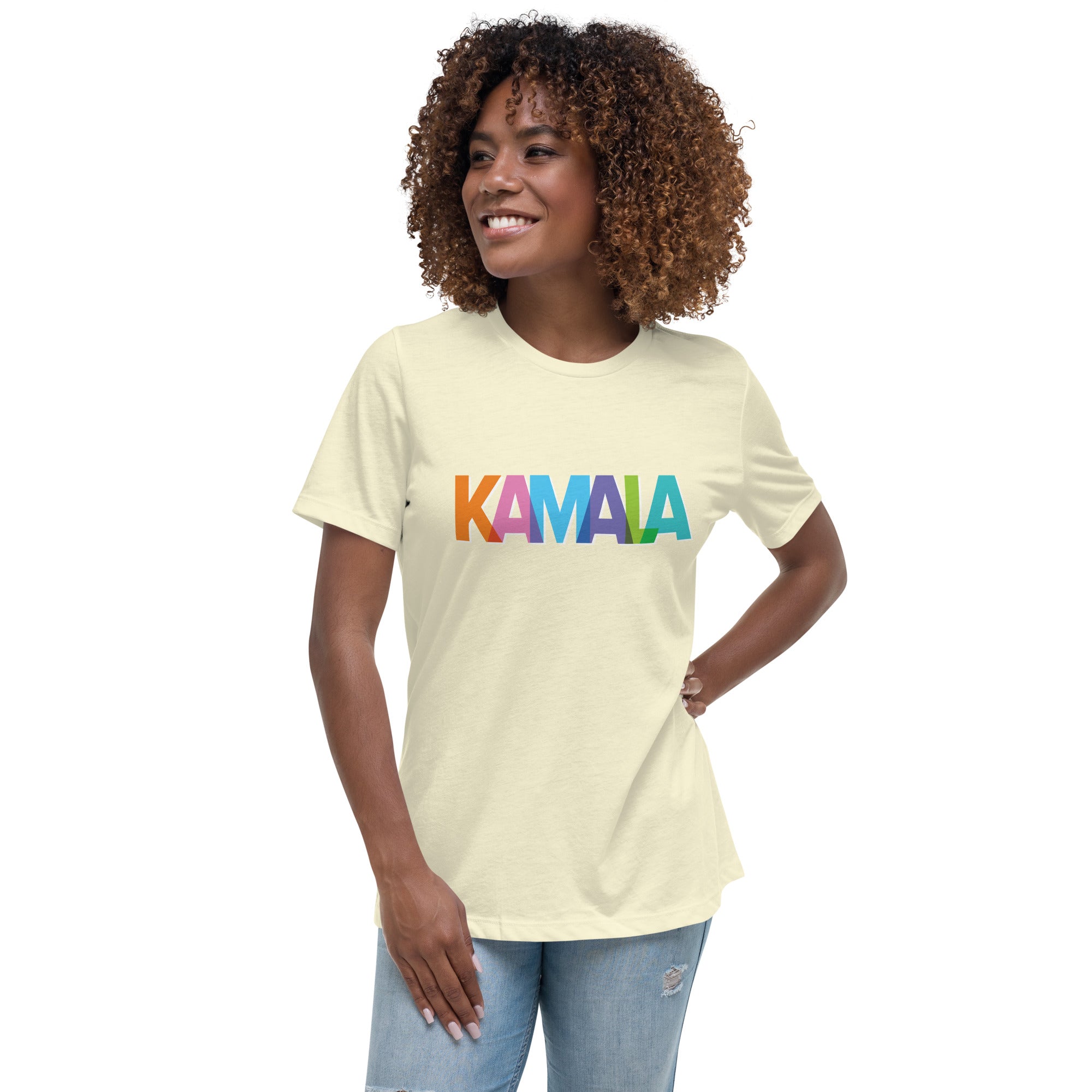 woman wearing citron colored women's t-shirt with KAMALA on the front with multi colored overlapping letters