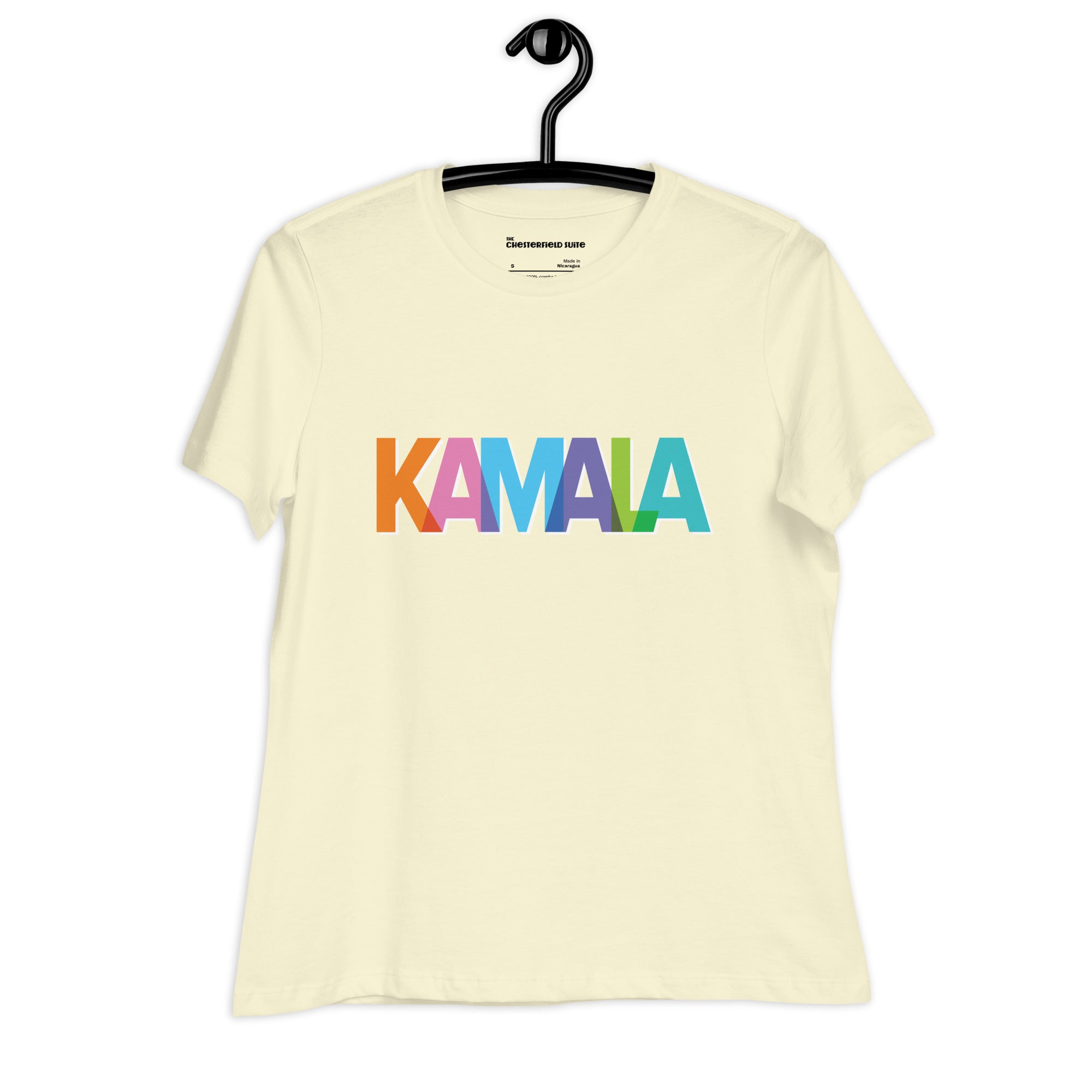 citron colored women's t-shirt with KAMALA on the front with multi colored overlapping letters on a black hanger