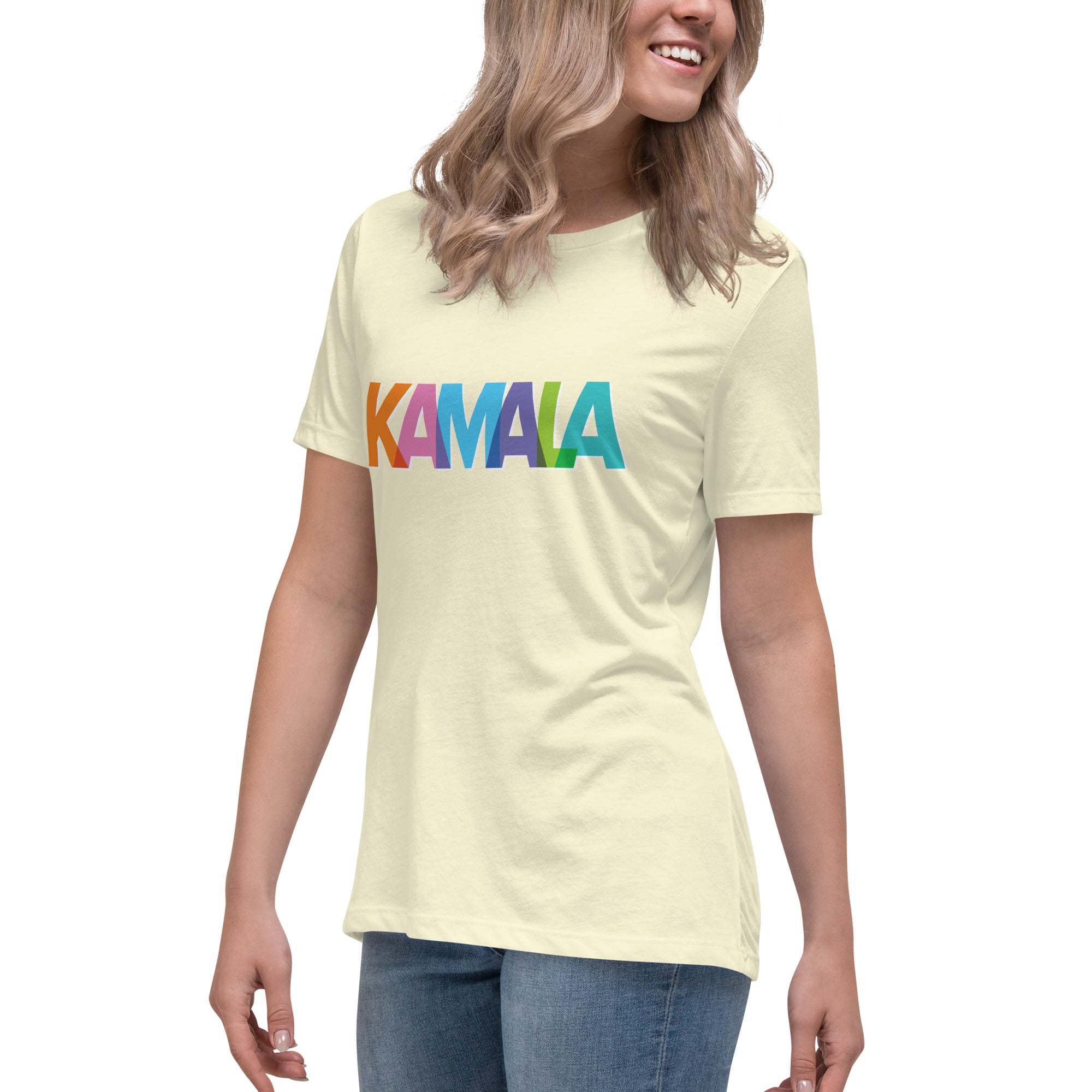 woman wearing citron colored women's t-shirt with KAMALA on the front with multi colored overlapping letters