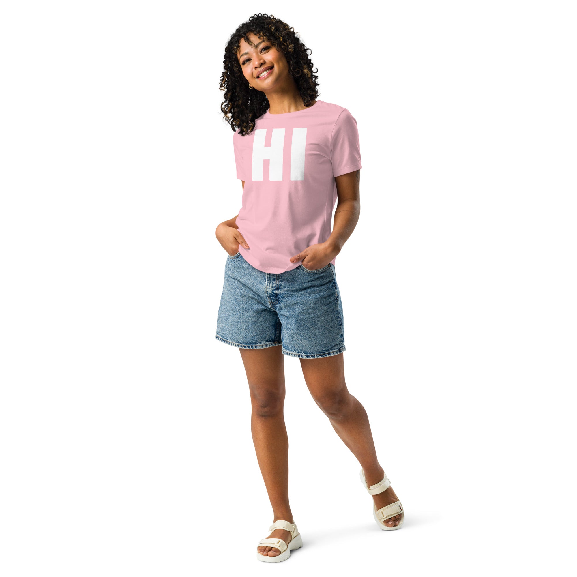 photo of a woman wearing the word HI in white on a pink women's t-shirt