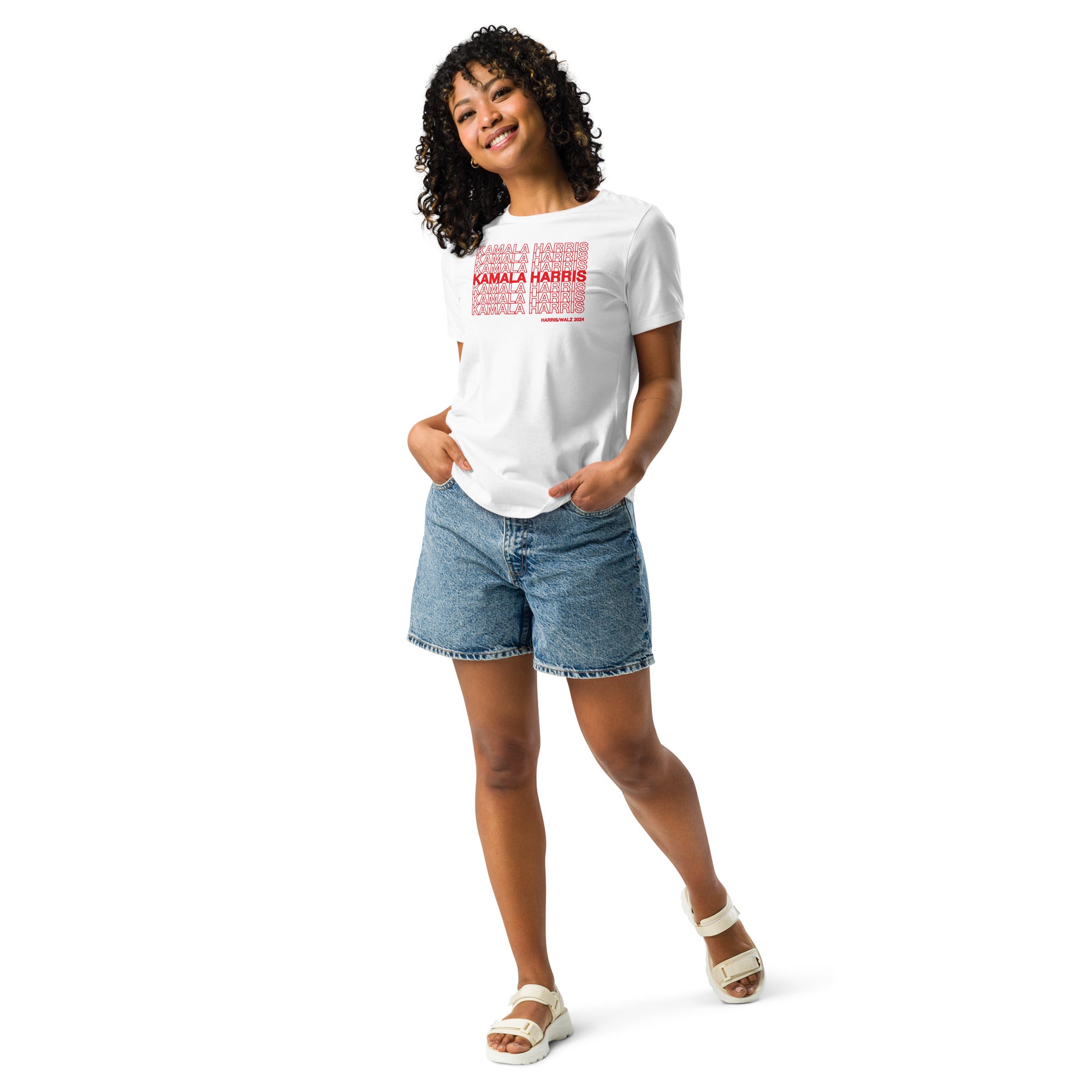 woman wearing White women's t-shirt with red text saying "kamala Harris" in the classic plastic shopping bag design