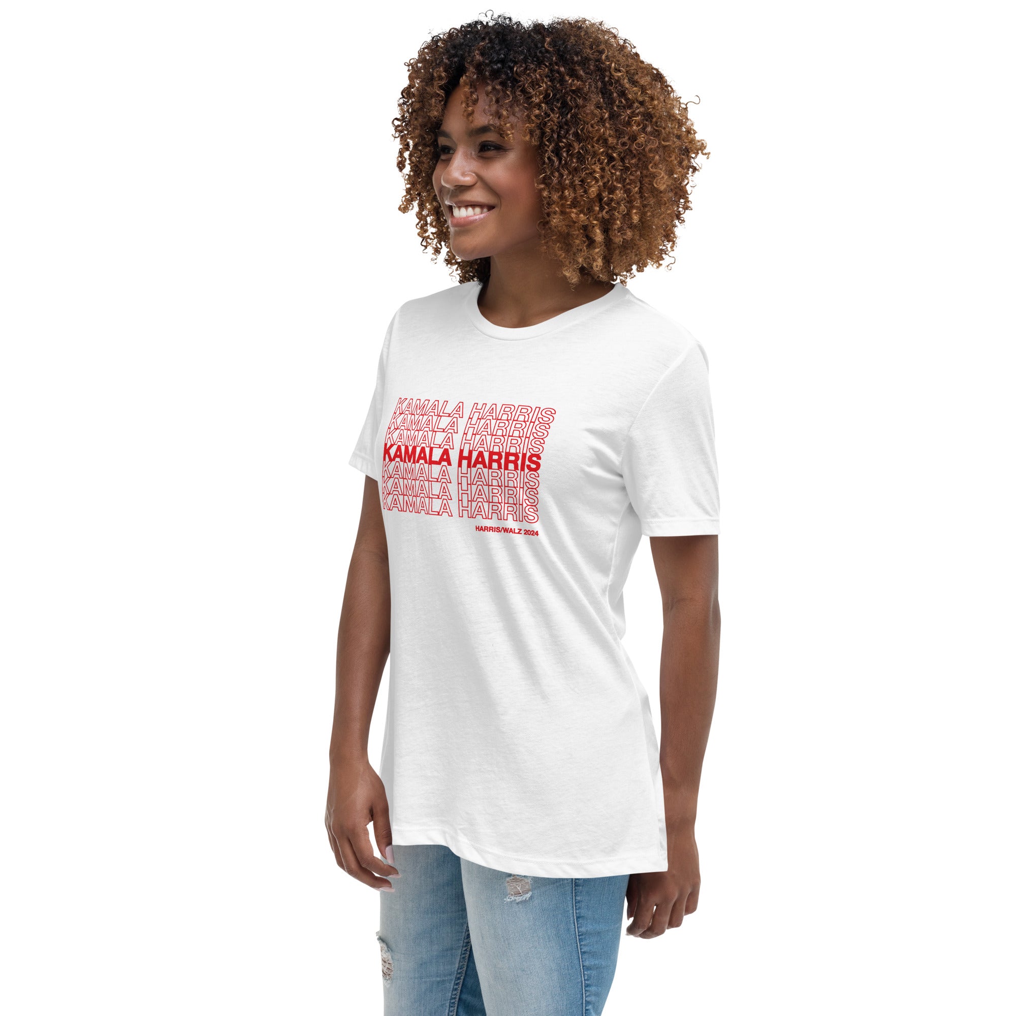 woman wearing White women's t-shirt with red text saying "kamala Harris" in the classic plastic shopping bag design