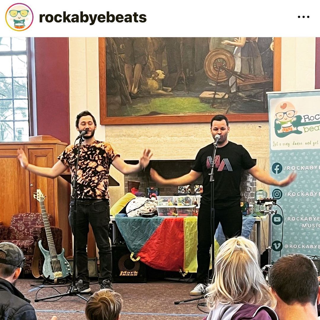 photo of rockabyebeats performing in MA massachusetts in neon 90s style lettering on black t-shirt