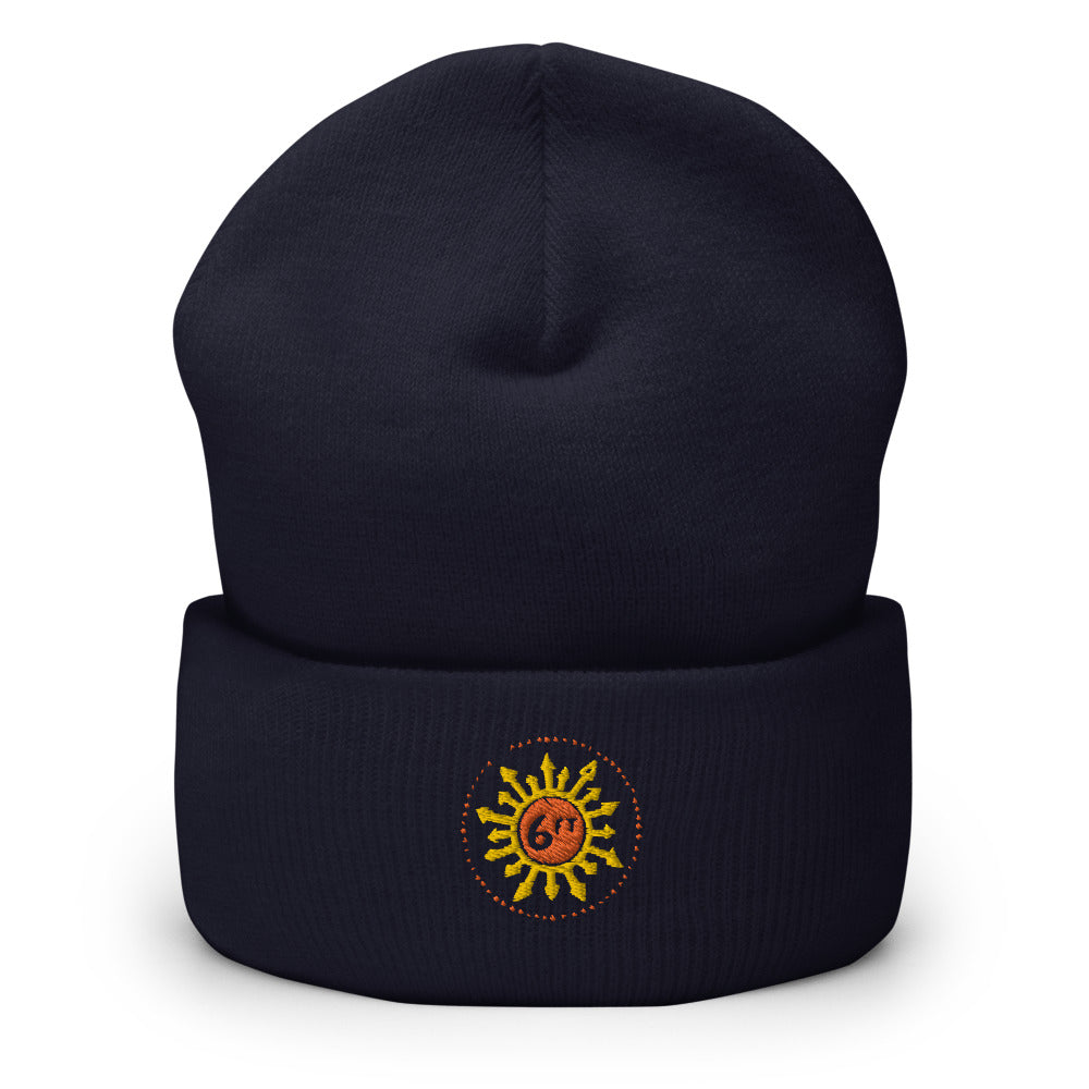 design with a sun made up of 6ft in the center and arrows going out in yellow and orange on black beanie